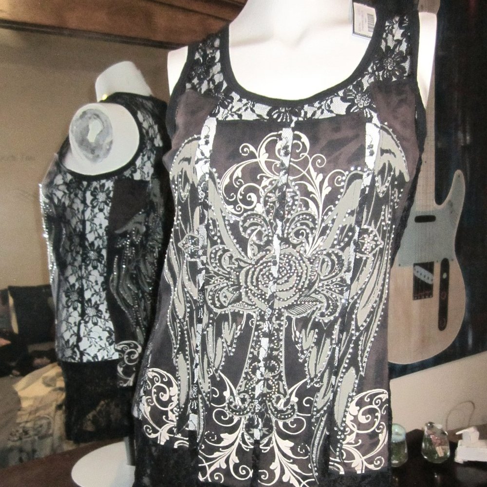 Black lace with bling. See through on sides and shoulders